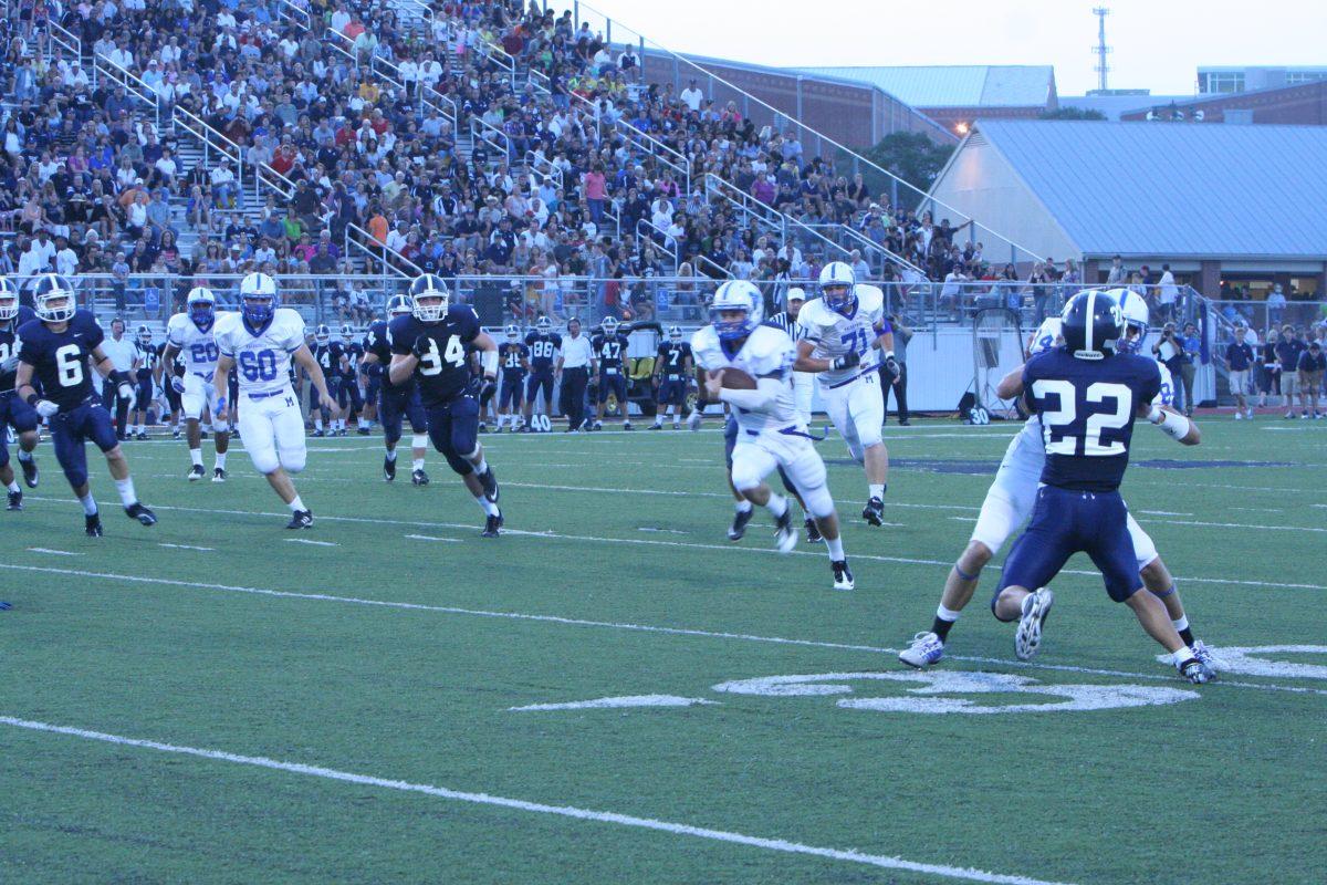 Clinton Killough (12) runs the ball. Photo by Zach Royston