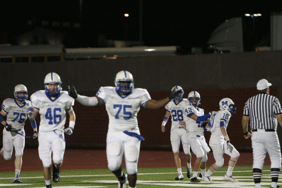 Ashaad Mabry (12) celebrates an interception returned for a touchdown