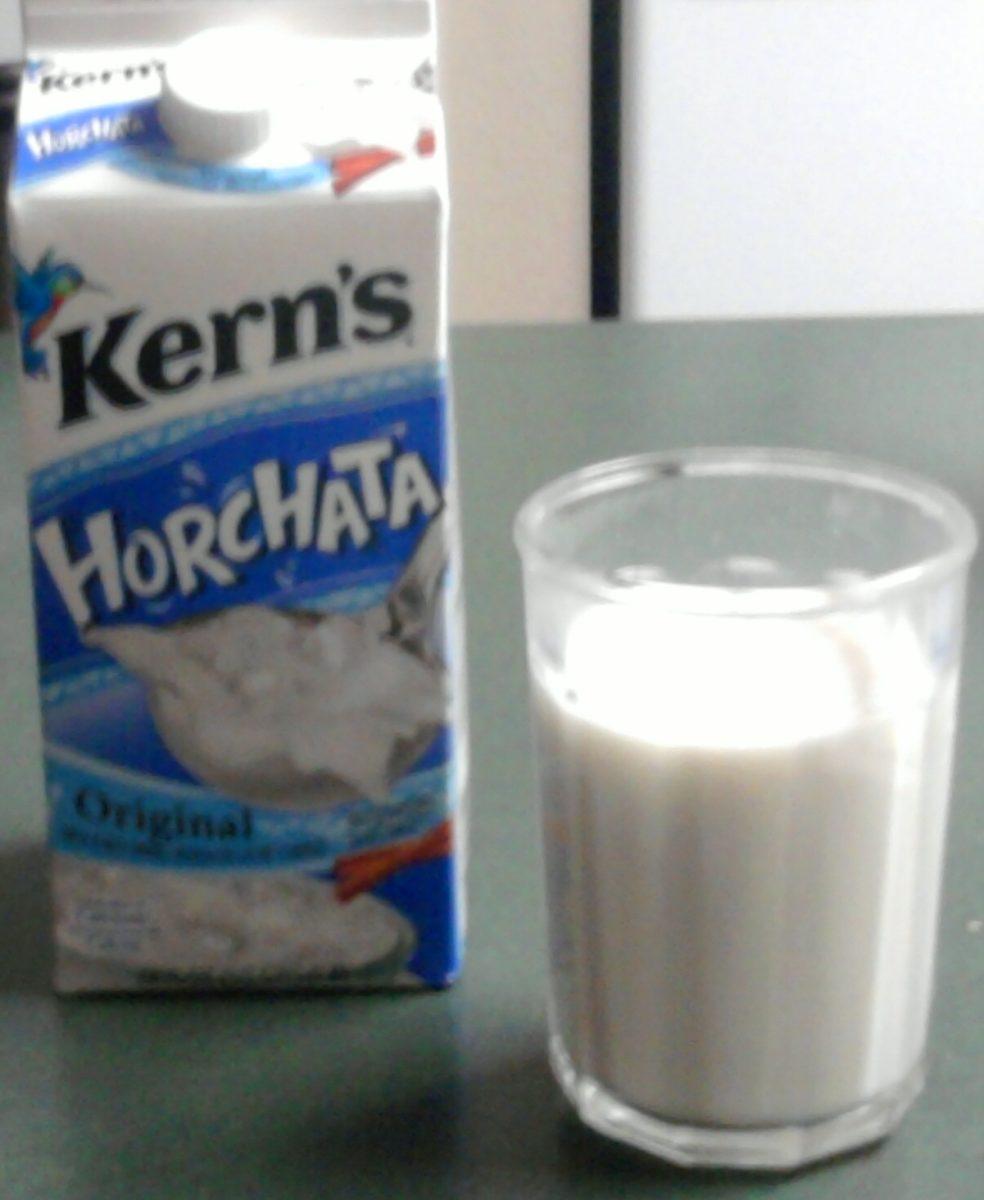 A carton of the Original Kern's Horchata from HEB beside a glass of my homeade agua de horchata.