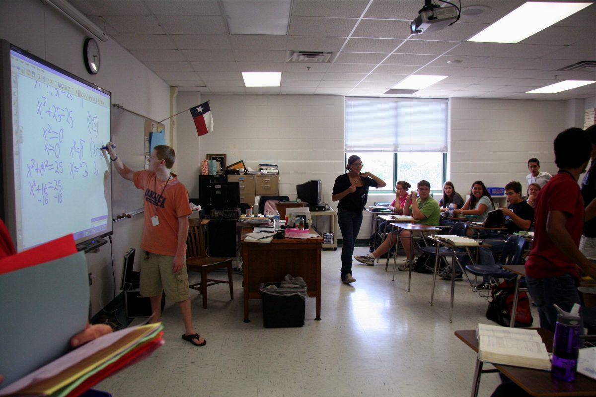 A student participates in class by solving a problem Photo by Helen Downs and Megan Feuerbacher