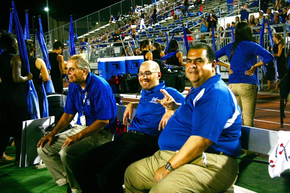 Mr. Martinez and Mr. Valdez enjoy the Stevens game. photo by Estefania Lamas 