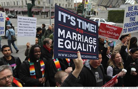 At a march for gay rights, someone holds a sign for marriage equality, photo by Justin Sullivan