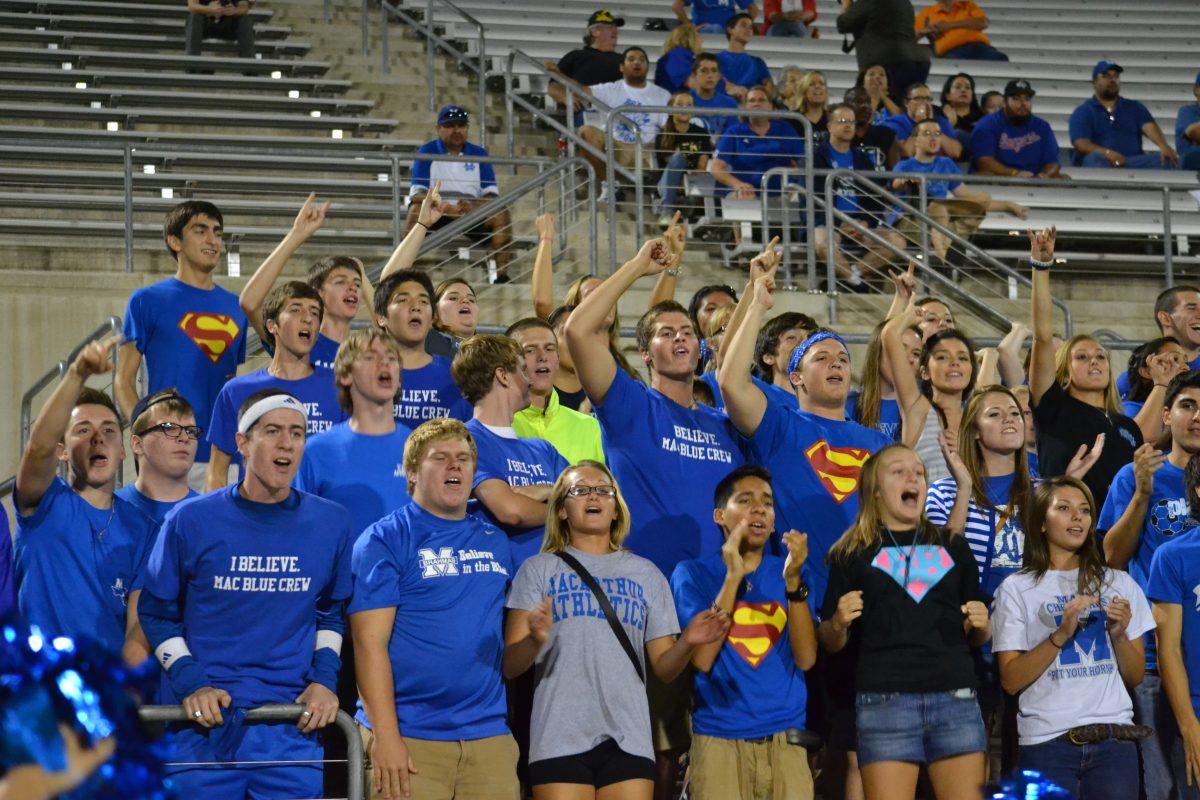 Rowdy Row, Bums and Babes and Blue Crew cheer for varsity football.
Photo by Sarah Morales