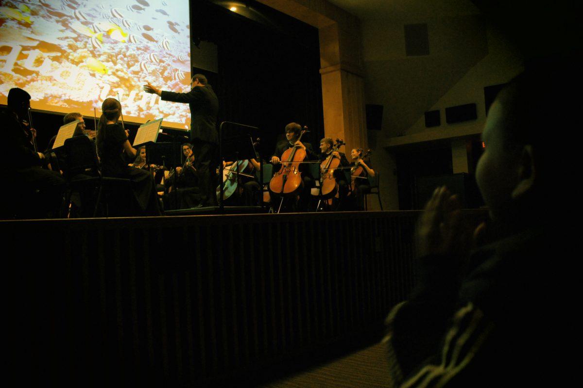 Mr. Davis conducting the symphony Orchestra