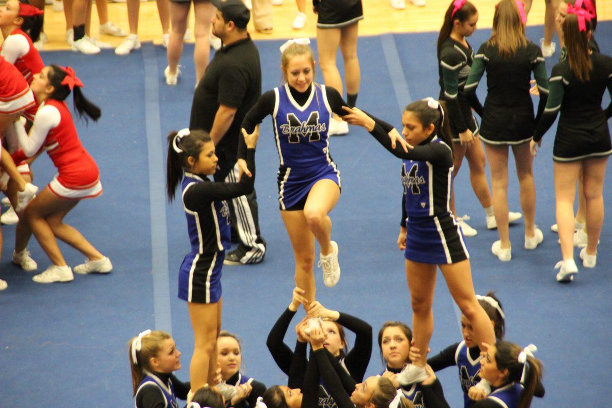 Varsity cheerleaders practice before OSS