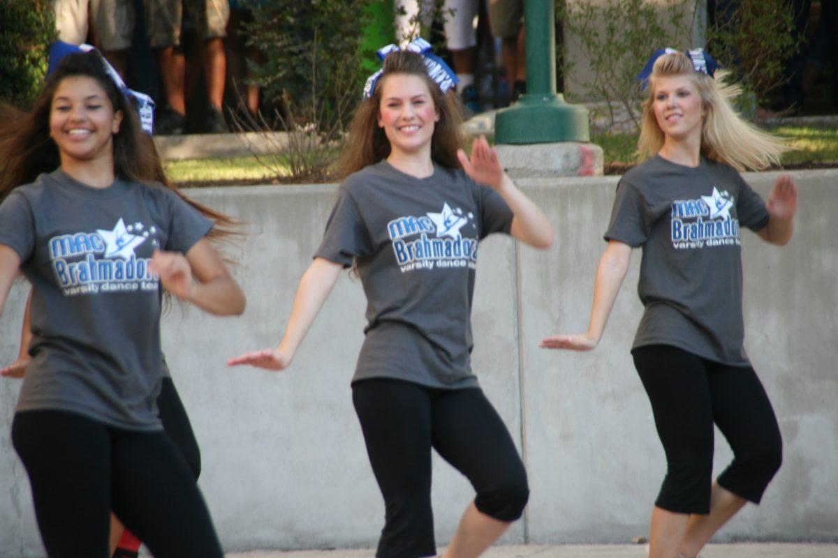 Francesca Cuello and Abby McBroom dance at the pep rally