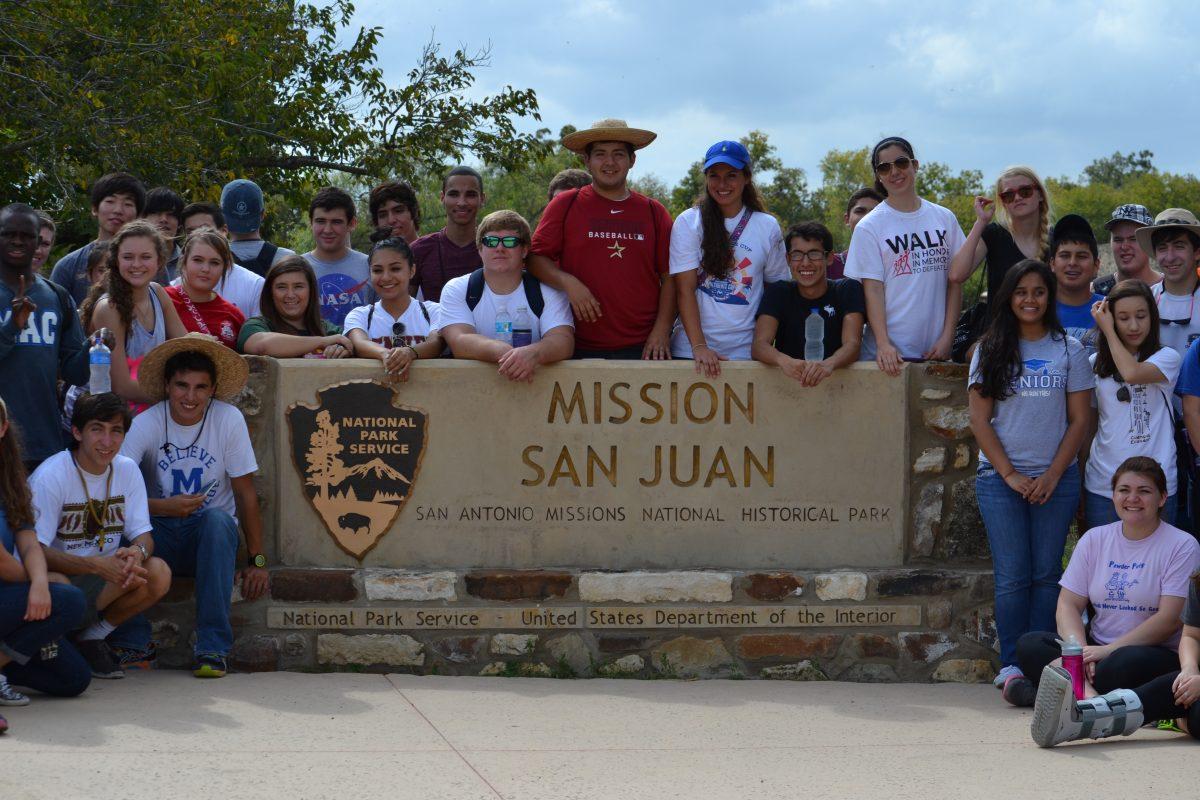 Students pose in front of the entrance sign of Mission San Juan
Photo by Sarah Morales