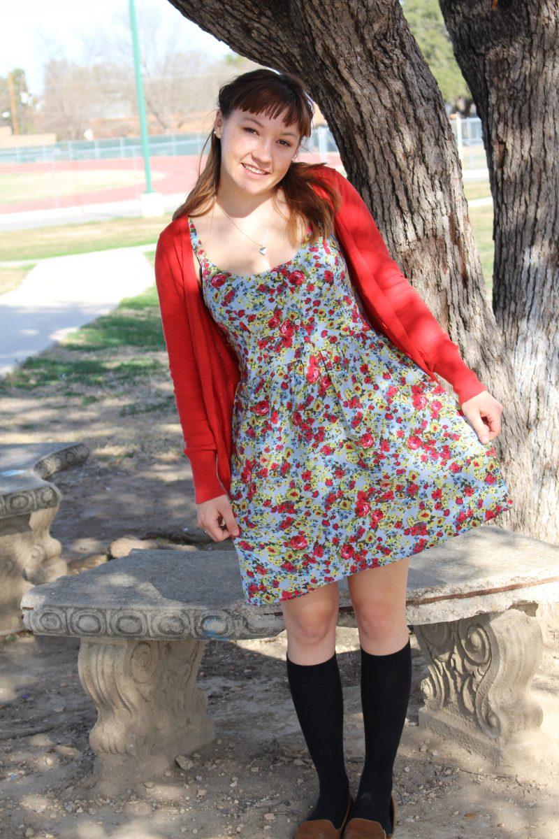 Megan Avery sporting her bright cardigan and flower print dress
Photo by Maddy Tompkins