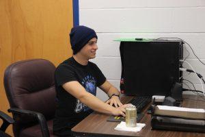 Senior Nathaniel Johnston finishes the competition  and starts to shut down his computer. Photo by Kayla Gunn.