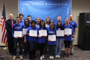 Students pose after receiving their certificates. Photo by Jacob Dukes