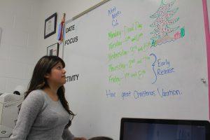 Senior Vanessa Ramirez checking out the dates of the exams this week. Photo by Kayla Gunn