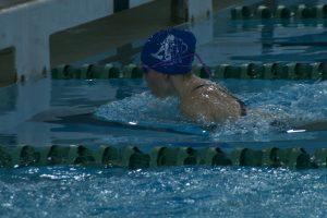 Meg Diamond finishing a lap at the Palo Alto swim meet. Photo by: Joseph Hightower