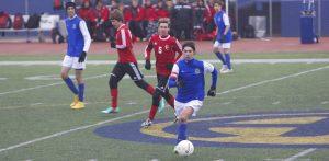 Senior Parker Miller dribbles the ball down the field and looks for an open lane. Photo by Jacob Dukes