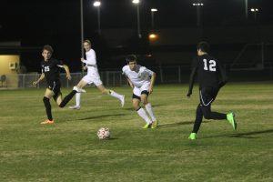 Junior defender Rox Guerrero eyes the ball, preparing to strike. Photo by Jacob Dukes