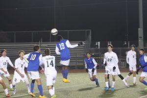 Battling for the ball, teams pushed and shoved and exchanged words in a very physical game. Photo by Jacob Dukes