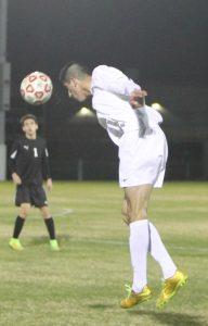 Senior midfielder Gustavo Rangel heads the ball to a teammate. Photo by Jacob Dukes