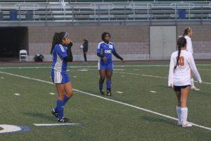 Sophomore midfielder Hailey Terrell warms her hands in the cold weather. Photo by Jacob Dukes