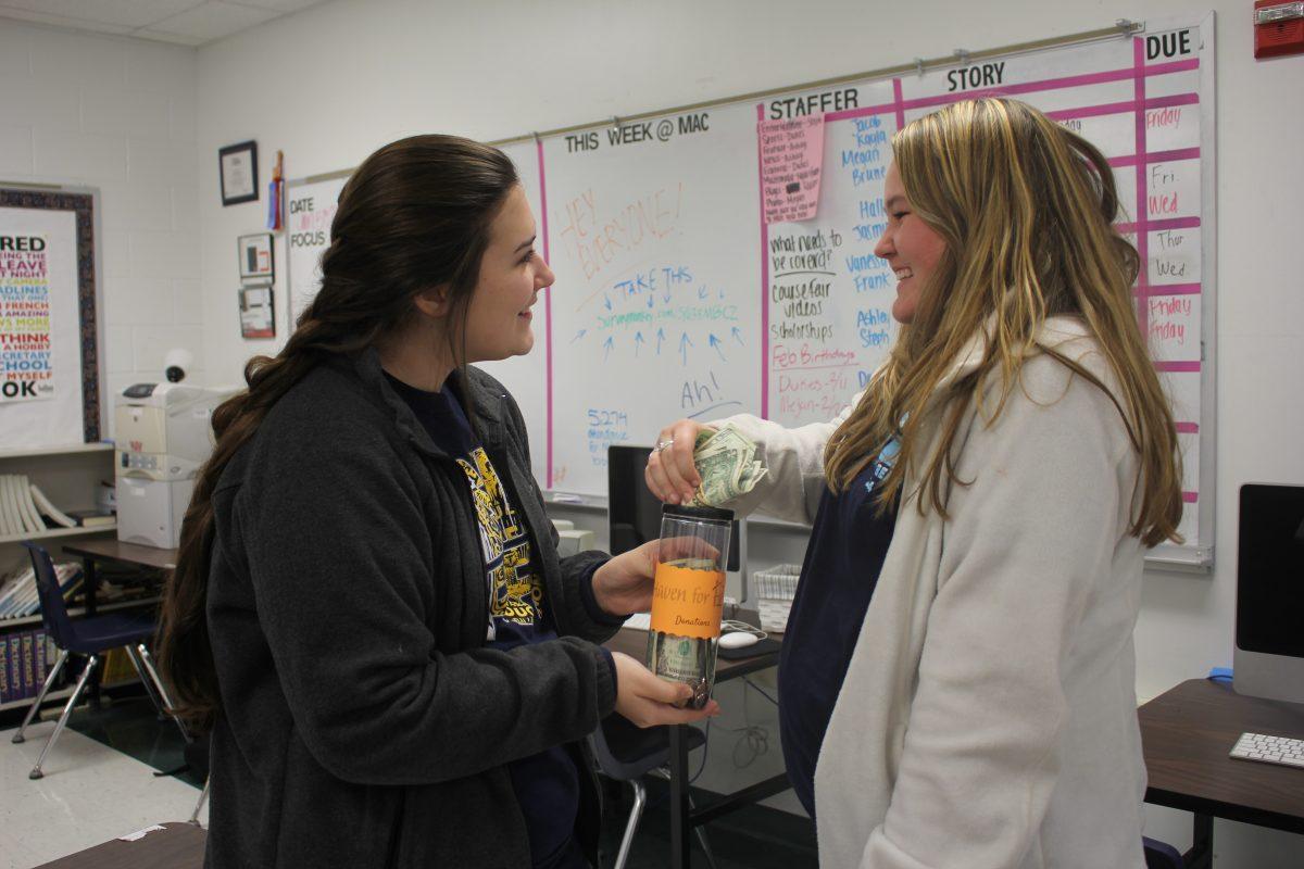 Ashley and Megan donating to Haven for Hope. Photo by Vanessa Ramirez.