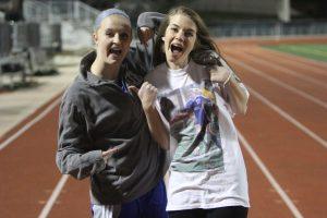 Giles and senior Madeline Senter, wearing a shirt with Giles picture on it, pose after the game. Photo by Jacob Dukes 