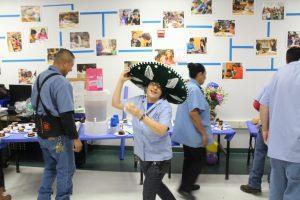 Miriam showing off her party hat. Photo by: Justin Wood