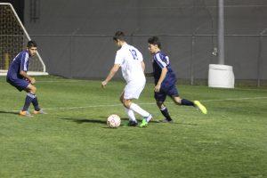 Parker Miller sets up a cross pass. Photo by Jacob Dukes