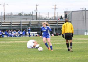 Junior Harley Little evades a defender after knocking her down. Photo by Jacob Dukes