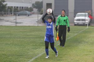 Sophomore Neely Haby prepares for a throw-in. Photo by Jacob Dukes