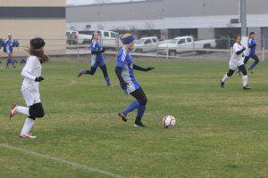 Senior Leslie Giles sets up for a long pass. Photo by Jacob Dukes