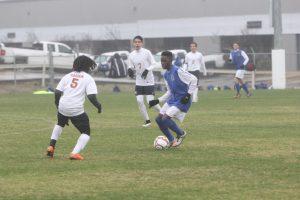 Sophomore Jarvian Wigfall jukes out a Madison defender. Photo by Jacob Dukes