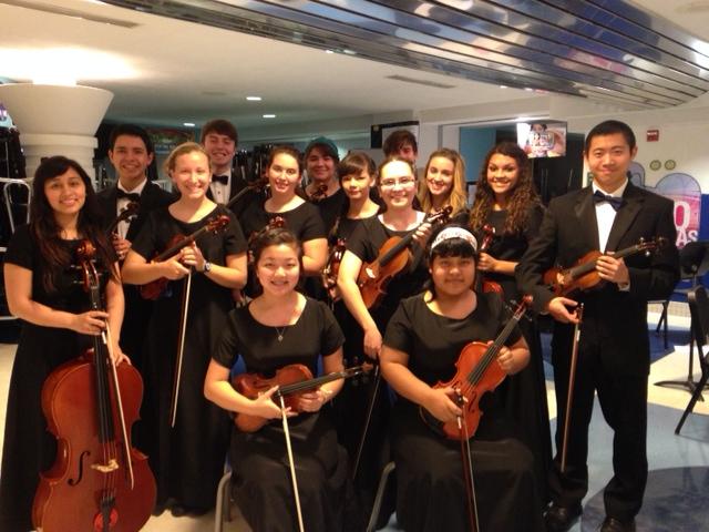 Orchestra gathered for photo to play for summa night. Photo by: Dr. Gaverick