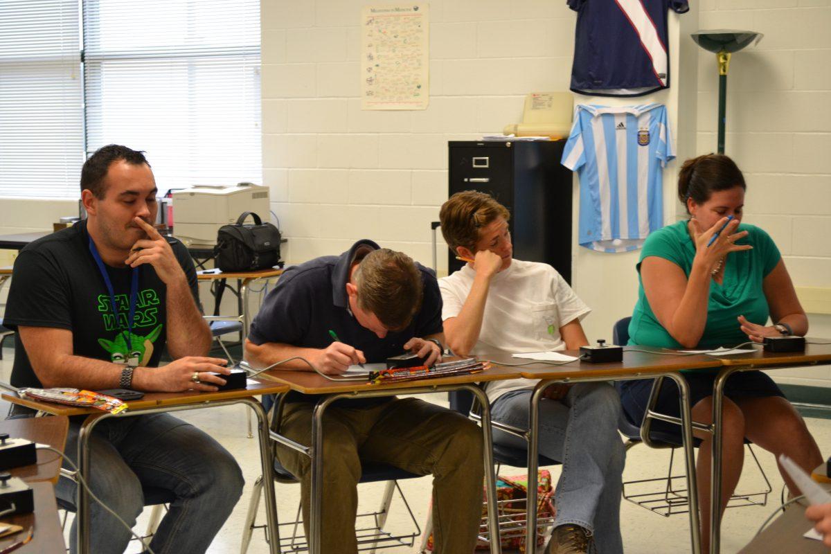 The science department pondering the answer for quiz bowl. Photo by Vanessa Ramirez