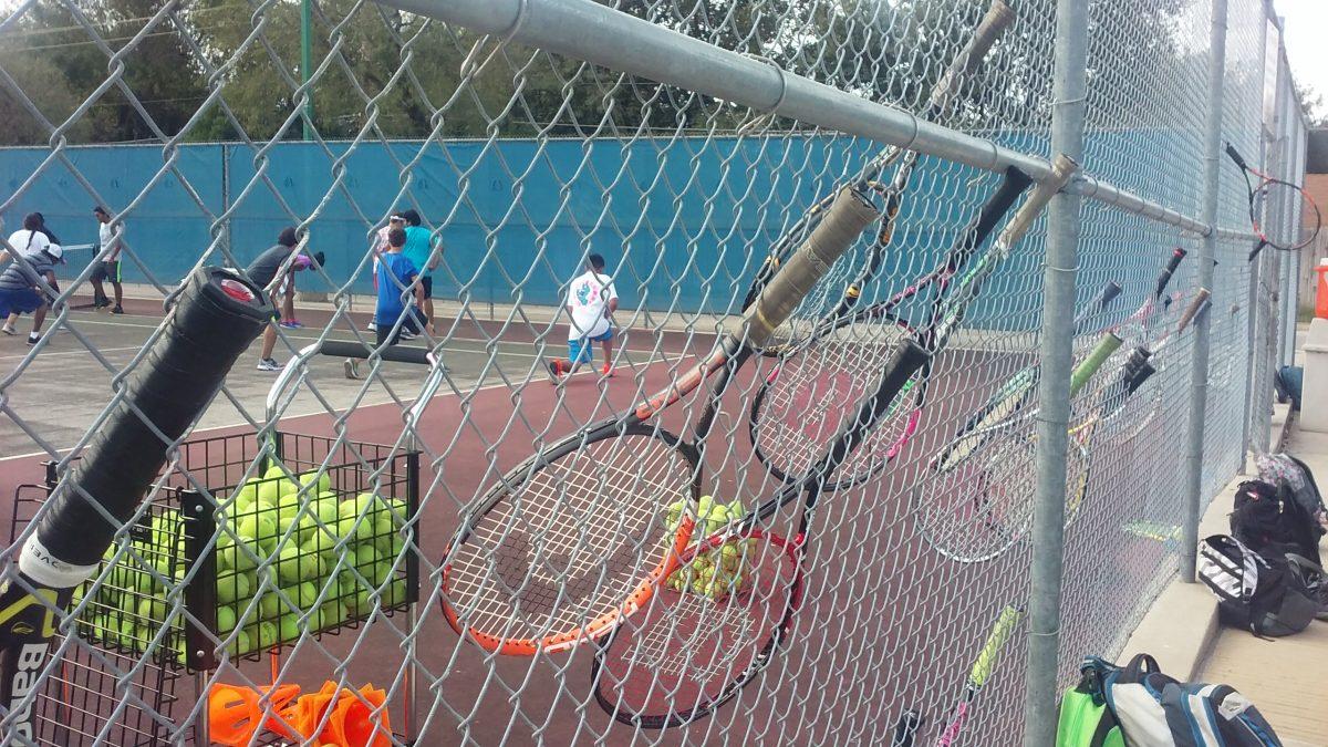 Tennis players warming up before practice