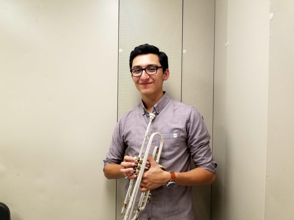 Sebaastian Tapia in the band practice room with his trumpet. Photo by Hannah Monita.