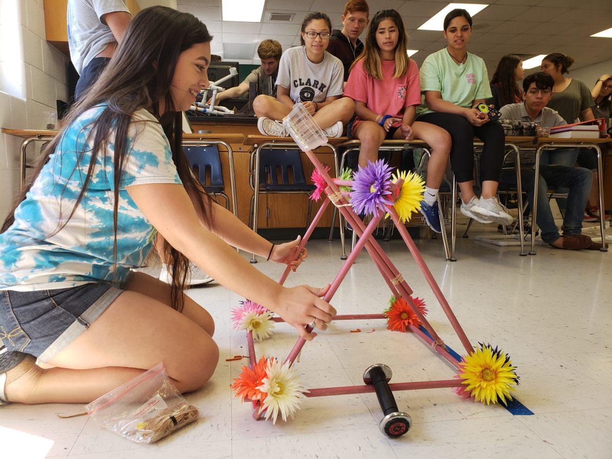 Marissa Flores with her floral catapult. Photo by Hannah Monita.