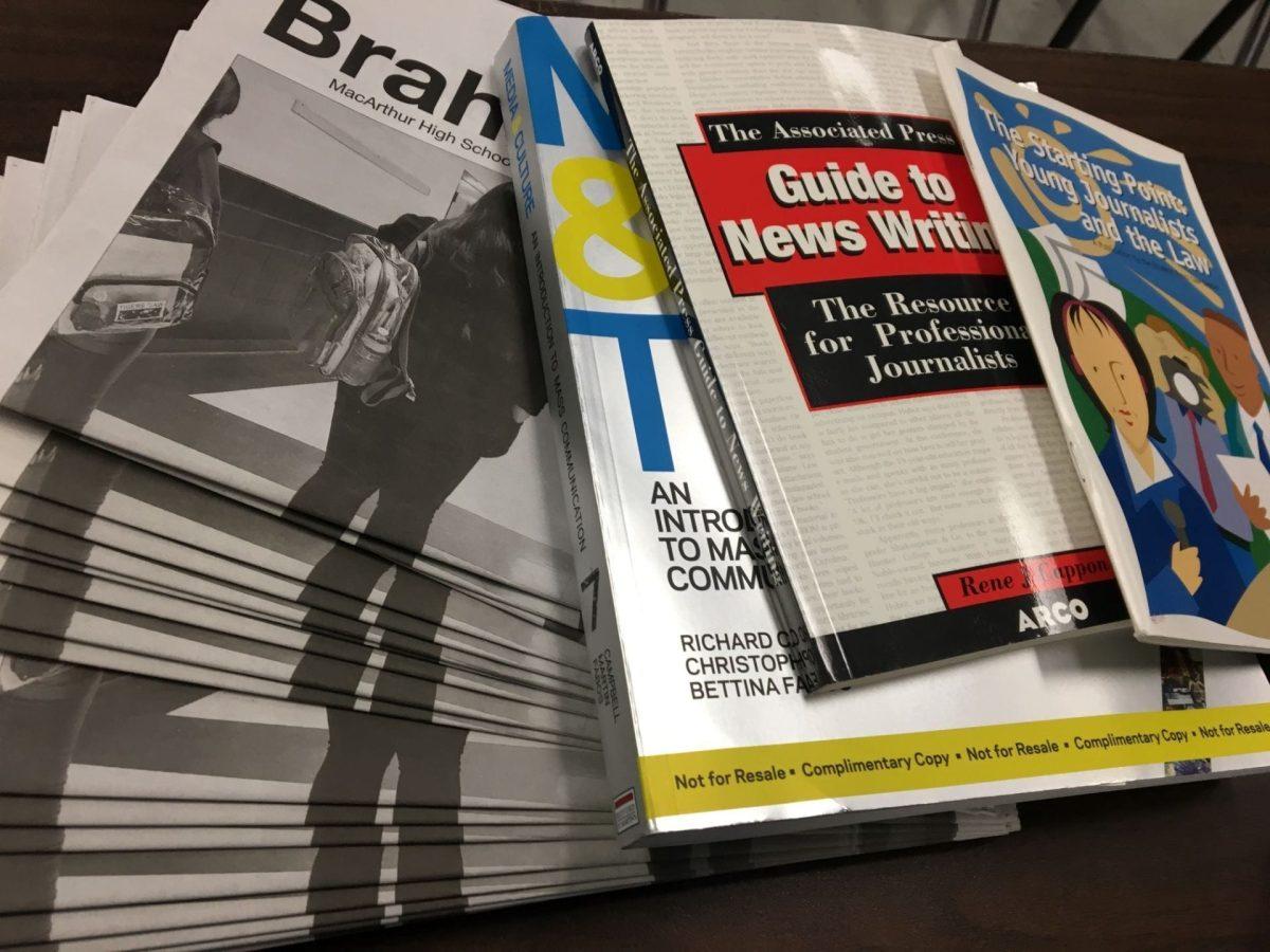 Newspapers and books about journalism. Photo by Karen Mendoza.