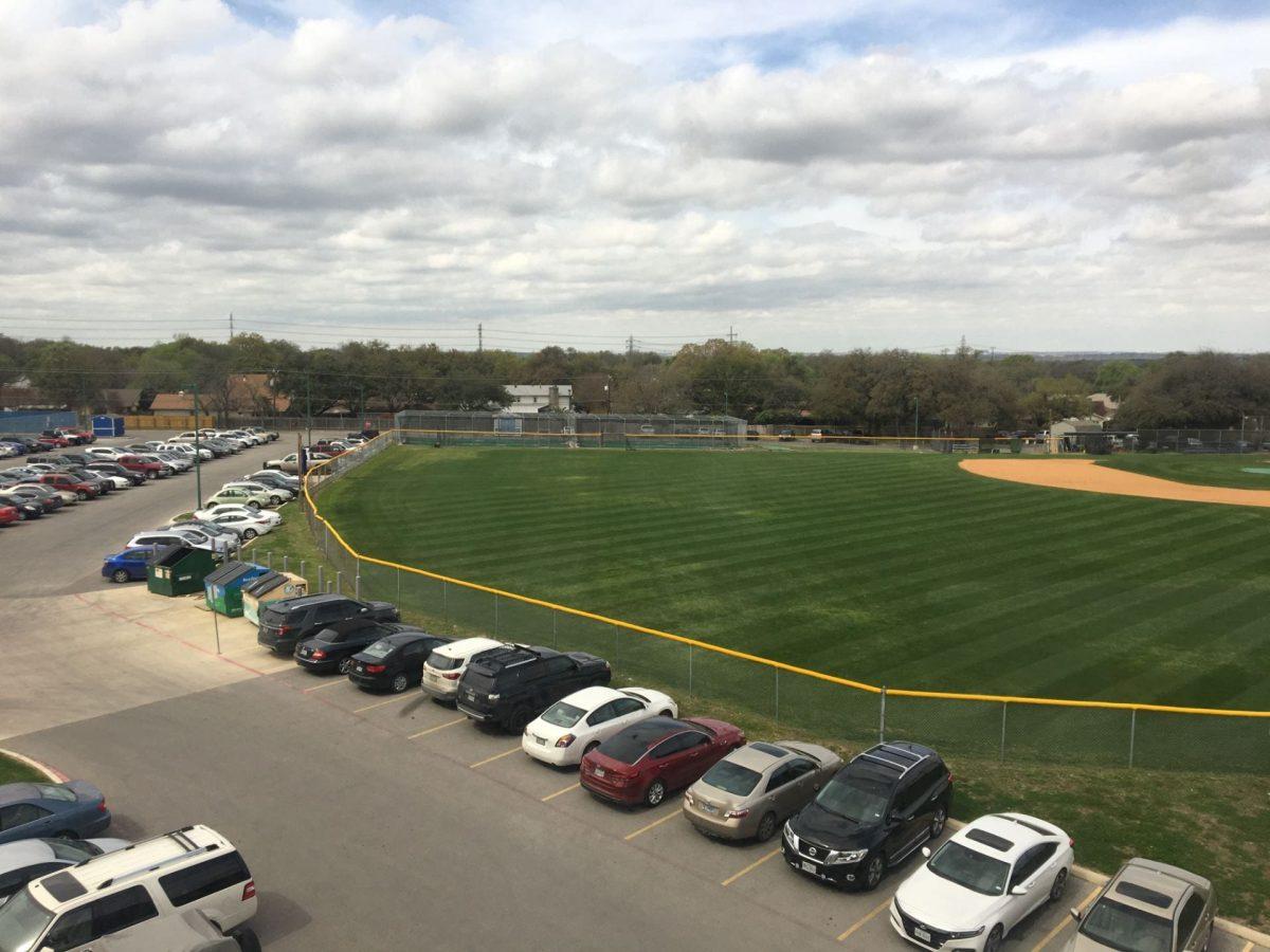 The baseball field and the cars in front of it. Photo by Karen Mendoza