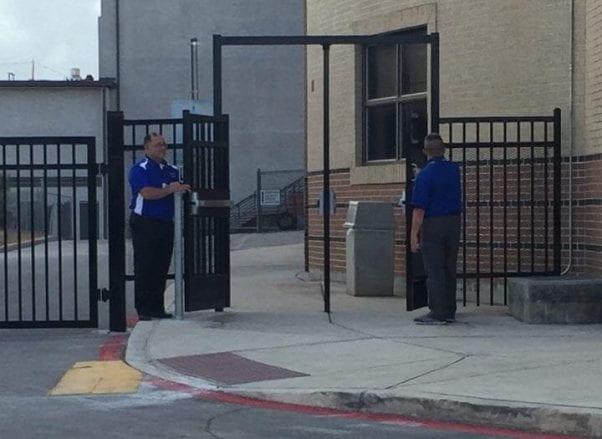 Mr. Martinez and Mr. Lewitt holding the gates open. Photo by Alexsis De La Garza.