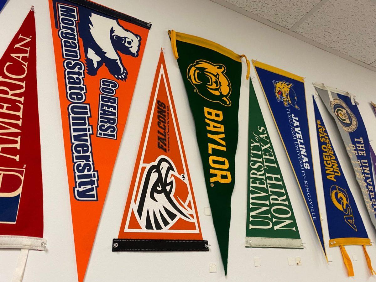 College banners hanging in the college and career center. Photo by Jessica Harden.