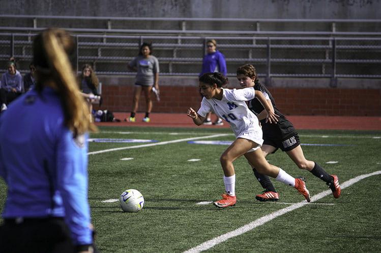 Mayra Salgado racing to get the ball at Heroes Stadium against Alamo Heights.