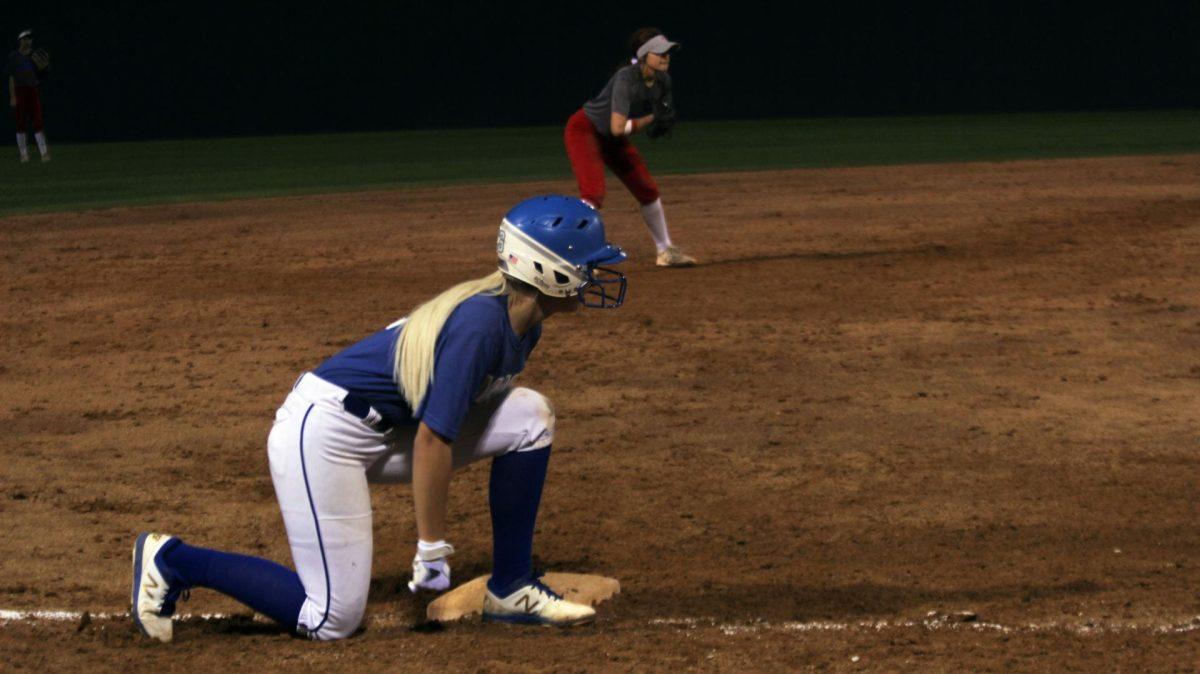 Waiting to run after the batter swings