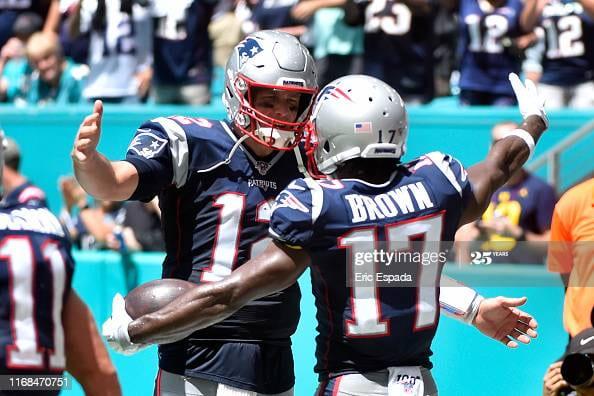 MIAMI, FL - SEPTEMBER 15: Antonio Brown #17 of the New England Patriots  celebrates with Tom Brady #12 after catching a touchdown in the second quarter of the game against the Miami Dolphins at Hard Rock Stadium on September 15, 2019 in Miami, Florida. (Photo by Eric Espada/Getty Images)