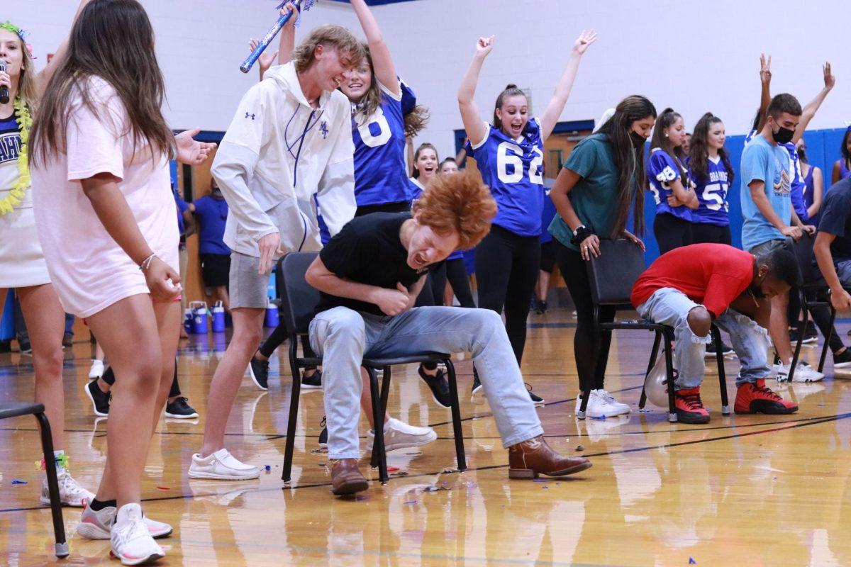 Baseball players win the balloon-pop relay race during the Hawaiian themed pep rally on Aug. 27, 2021 in the gym.