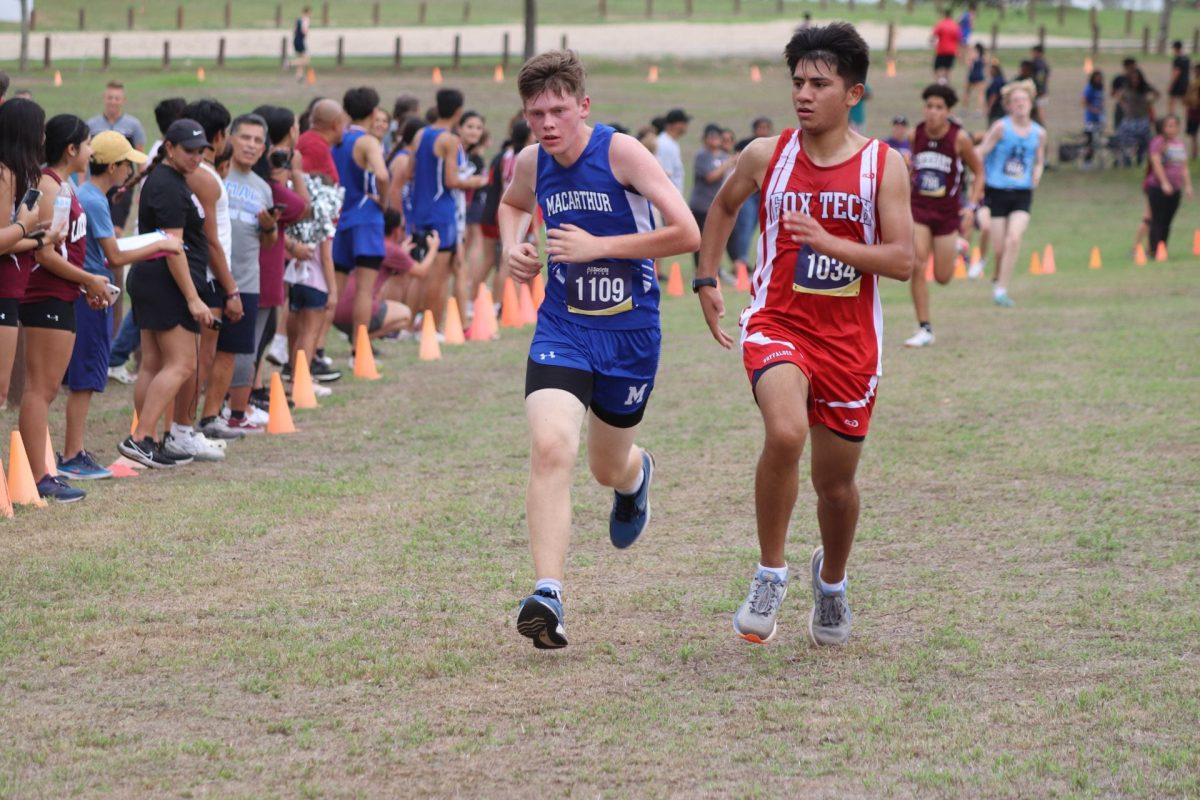 Asher Lambert fights for his place before crossing the finish line. Lambert pushed himself to compete, using his last ounce of energy.