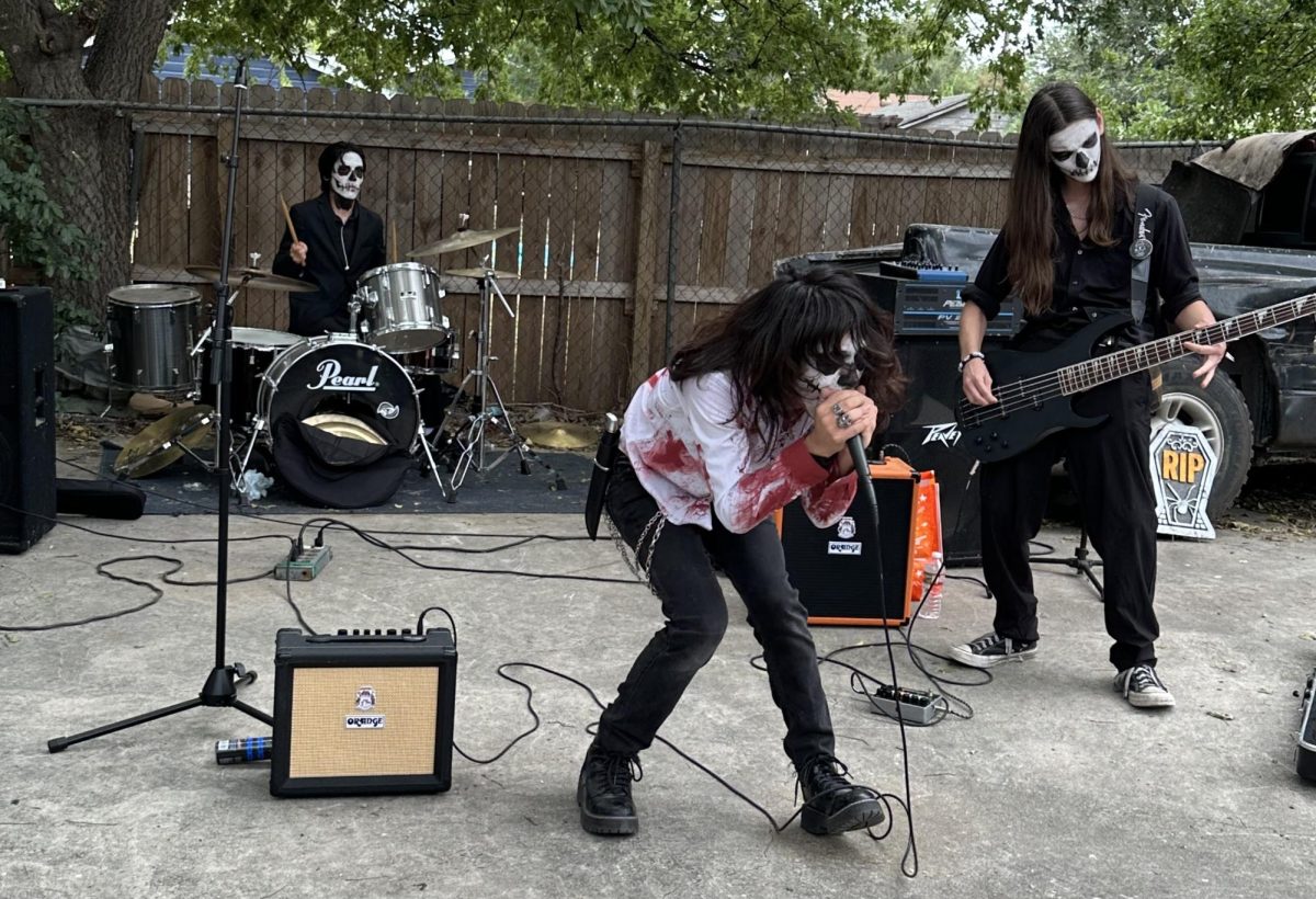 Performing one of their original songs, Urban Casket singer Nathan screams into the mic. photo by Kaii Campos